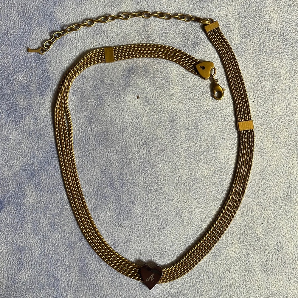 Keep collective by Stella and dot. Gold chain necklace with silver A charm.